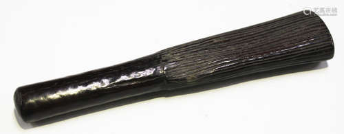 A 19th century carved ironwood club, probably South Seas, the smooth handgrip issuing a flared end