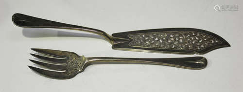 A pair of Victorian silver fish servers with pierced and engraved decoration, London 1864 by Chawner