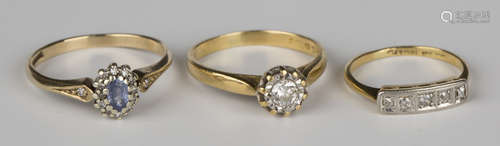 An 18ct gold and diamond single stone ring, mounted with a circular cut diamond, a gold, platinum