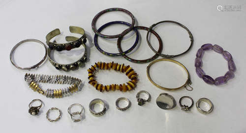 Nine mostly silver rings, three cloisonné bangles, eight other bangles and bracelets, six costume