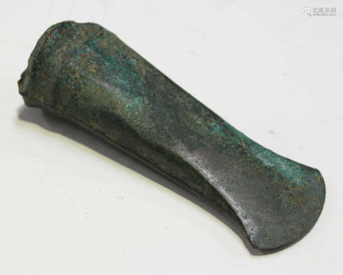 A German Bronze Age socketed axe head of typical form with ribbed and moulded socket, detailed in