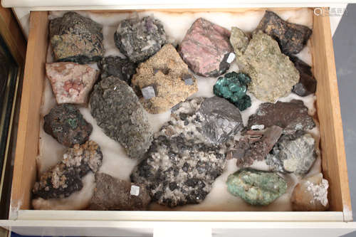 A large selection of various mineral specimens, including galena on barytes, pearl quartz,