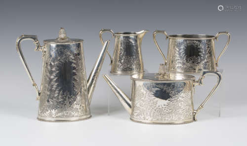 A Victorian silver four-piece tea set of oval form, engraved with fern fronds between beaded rims,
