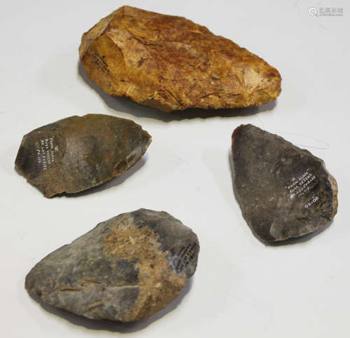 A group of four French Palaeolithic hand axes, each with details in black or white ink, including '