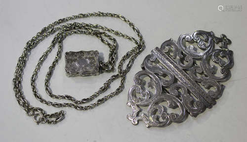 A Victorian silver rectangular vinaigrette with engraved decoration, the hinged lid revealing a