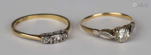 A gold and diamond single stone ring, claw set with a circular cut diamond, ring size approx K,