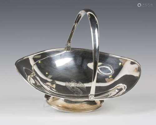 A Victorian silver oval basket with swing handle, the centre engraved with a winged mythical