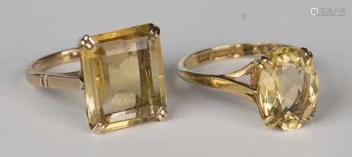 A 9ct gold ring, claw set with a rectangular step cut citrine, ring size approx J1/2, and another