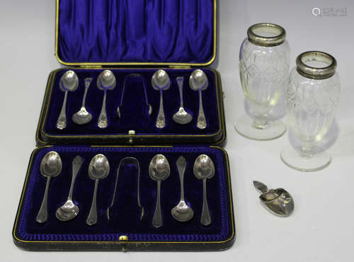 A set of six Edwardian silver coffee spoons and a matching pair of sugar tongs, engraved with