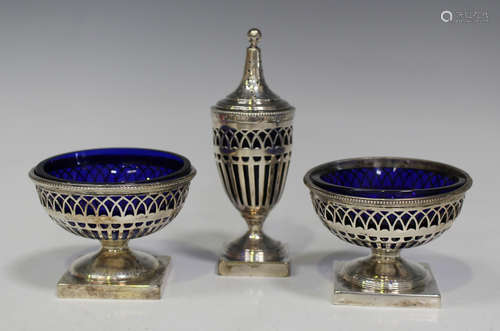 A George V silver three-piece condiment set with pierced decoration, on square bases, Chester 1912