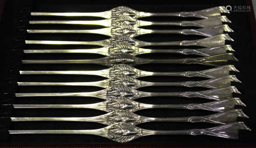 A set of twelve German .800 silver lobster picks, each decorated with a lobster, length 21cm,