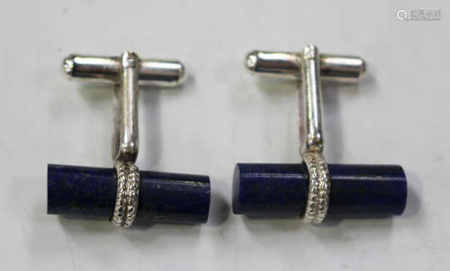 A pair of lapis lazuli cufflinks, each with a cylindrical lapis lazuli baton to the front and