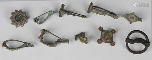 A collection of mixed Ancient Roman brooches, including a hair brooch, four ancissa type brooches