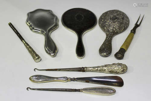 Three silver mounted hand mirrors, one with a piqué inlaid tortoiseshell back, Birmingham 1925,