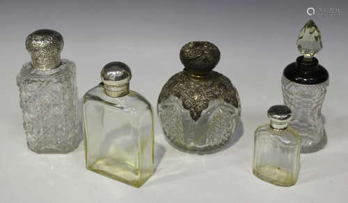 A Victorian silver mounted cut glass perfume bottle of rectangular form with hinged screw lid and