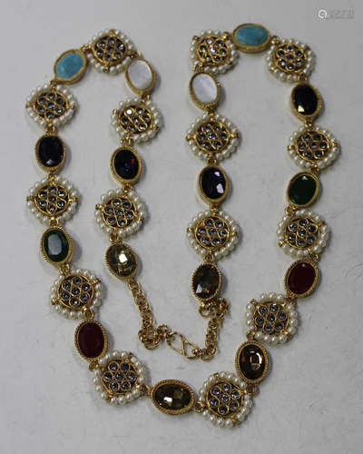 An Indian imitation pearl, mother-of-pearl and foil backed vari-coloured gem set costume necklace,