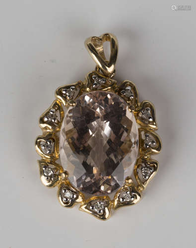 A 9ct gold, morganite and diamond pendant, claw set with the oval morganite within a surround of