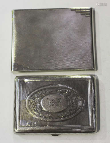 A Victorian silver rectangular card case with fitted interior, engraved with flowers within oval