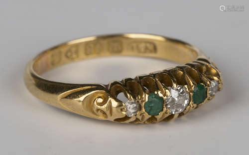 An 18ct gold, diamond and emerald five stone ring, mounted with three diamonds alternating with