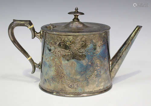 A late Victorian silver oval teapot, engraved with scroll cartouches between beaded rims, London