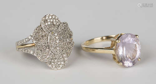 A 9ct gold and diamond ring, designed as a flowerhead, with split shoulders, pavé set with