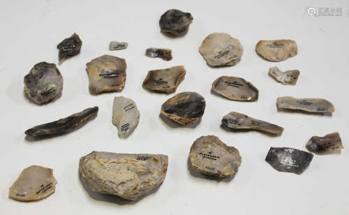 A small collection of Stone Age flint tools from Surrey, including scrapers and cutting tools,