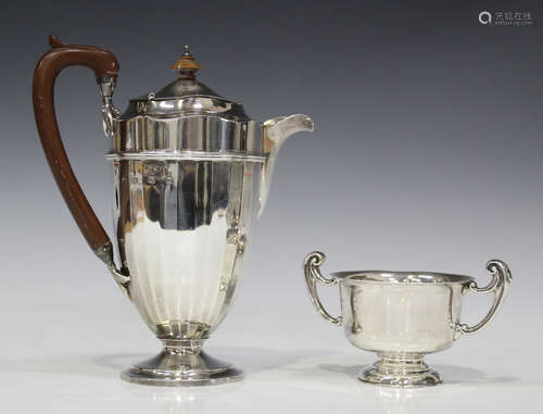 A George V silver faceted coffee pot on a circular foot, Birmingham 1928 by Adie Brothers Ltd,