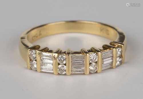 A gold and diamond ring, mounted with four pairs of circular cut diamonds alternating with three