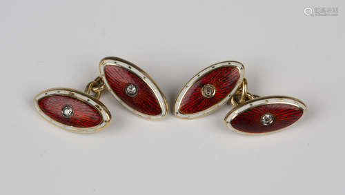 A pair of gold, enamelled and diamond cufflinks, each oval back and front centred by a cushion