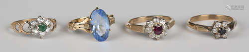 A 9ct gold, emerald and colourless gem set cluster ring, a gold and pale blue gem set solitaire