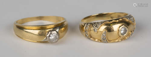 A gold and diamond single stone ring, mounted with a circular cut diamond in a raised design, ring