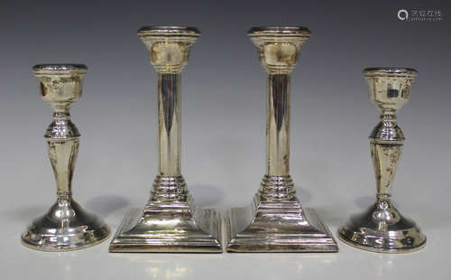 A pair of Elizabeth II silver candlesticks with square bases, Birmingham 1962, height 16.5cm, and