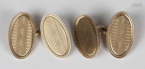 A pair of 9ct gold oval cufflinks, the backs and the fronts with engine turned decoration,