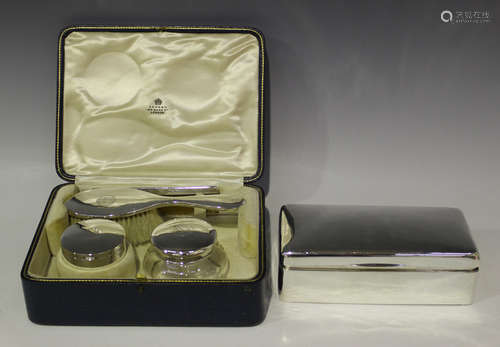 A George V harlequin silver mounted dressing table set for Asprey, comprising a glass jar and cover,