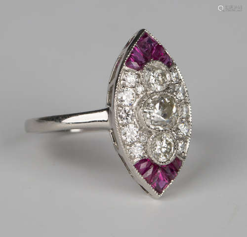 A platinum, diamond and ruby marquise shaped cluster ring, collet set with three principal