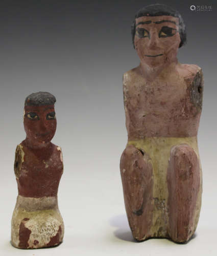 An Ancient Egyptian carved wooden figure, Middle Kingdom period, circa 2000-1800 BC, modelled as a