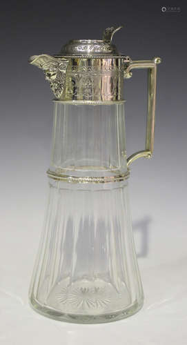 A Victorian silver mounted tapering cylindrical facet cut glass claret jug, the engraved hinged