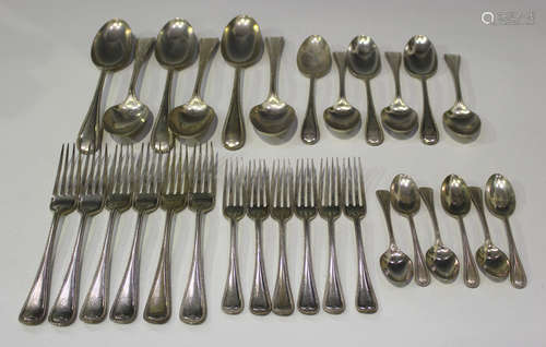 An Edwardian silver beaded Old English pattern part canteen of cutlery, comprising six tablespoons