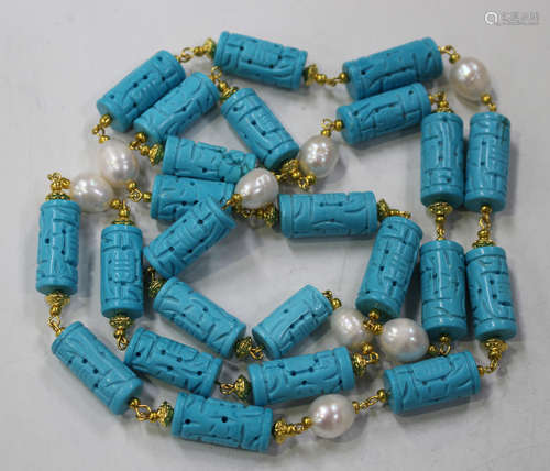 An Indian reconstituted turquoise and fresh water cultured pearl necklace in a baton shaped link