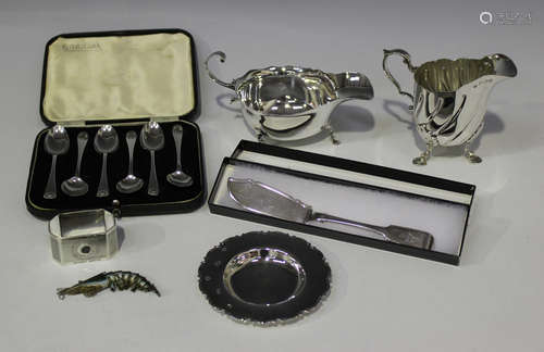 A set of six George VI silver teaspoons with shell terminals, Sheffield 1938, cased, together with a