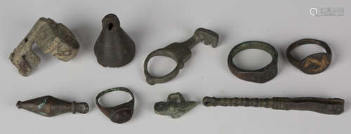 A group of miscellaneous Ancient Roman artefacts, including a key ring, a key, a votive pendant