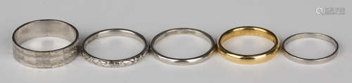 A 22ct gold plain wedding ring, ring size approx J, two platinum wedding rings and two further