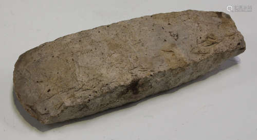 A large Danish Stone Age flint axe head of overall flaked and shaped form, detailed in white ink '