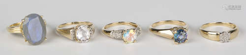 A 9ct gold and circular cut harlequin topaz single stone ring, a 9ct gold and oval cut colourless