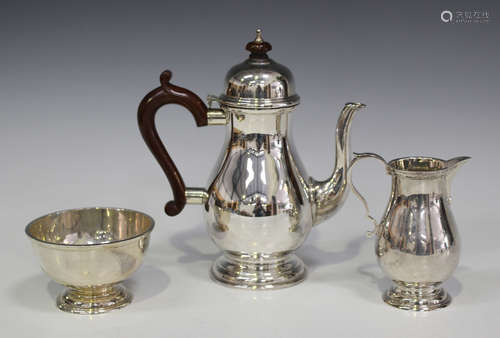 An Elizabeth II silver coffee pot of baluster form, London 1969 by Wakely & Wheeler, height 20.