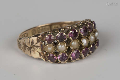 A Victorian 9ct gold seed pearl and mauve gem set ring, mounted with a row of seed pearls between