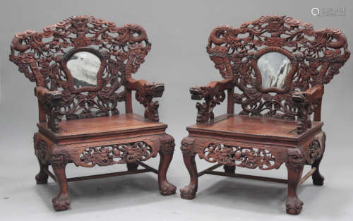 A pair of Chinese hardwood armchairs, 20th century, each back inset with a dream stone marble