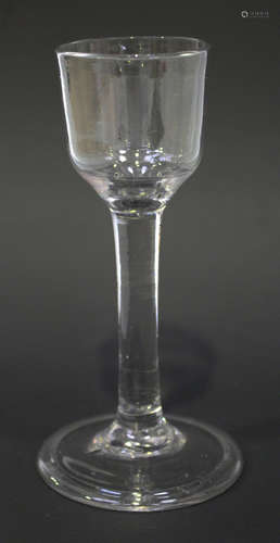 A plain stem wine glass, mid-18th century, the ogee bowl on a plain stem and folded conical foot,