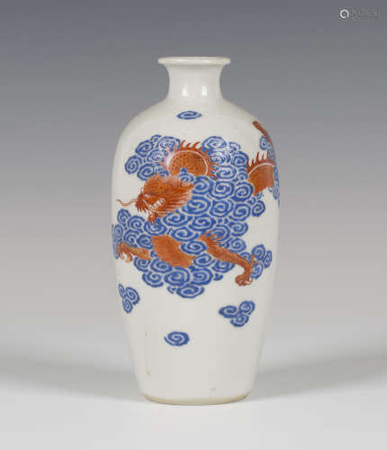 A Chinese blue enamelled and iron red painted porcelain vase, Jiaqing period, the elongated ovoid
