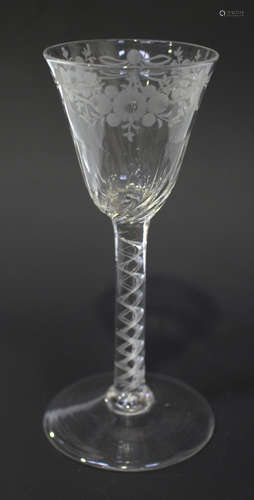 An engraved airtwist stem wine glass, mid-18th century, the roundel funnel bowl engraved to the